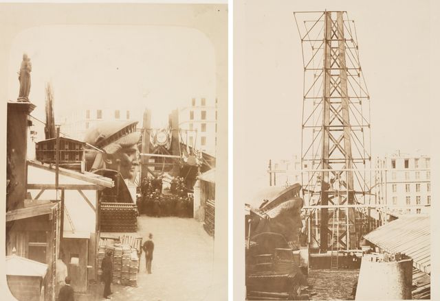Scaffolding for the assemblage of the Statue of Liberty, of which the head is shown at left, in Paris.